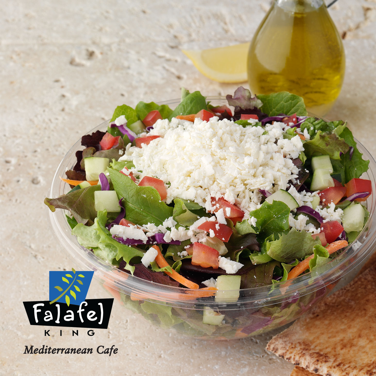 Greek Salad|Served with fresh mixed greens, feta cheese & pita.