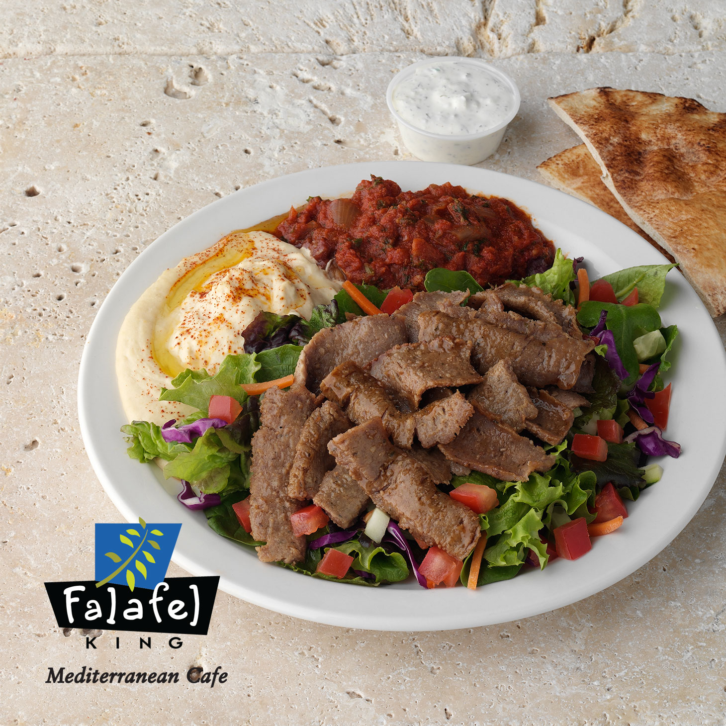 Gyro Plate|Grilled Beef & Lamb with Tzatziki Sauce. Served with fresh mixed greens, 2 mediterranean sides & pita.